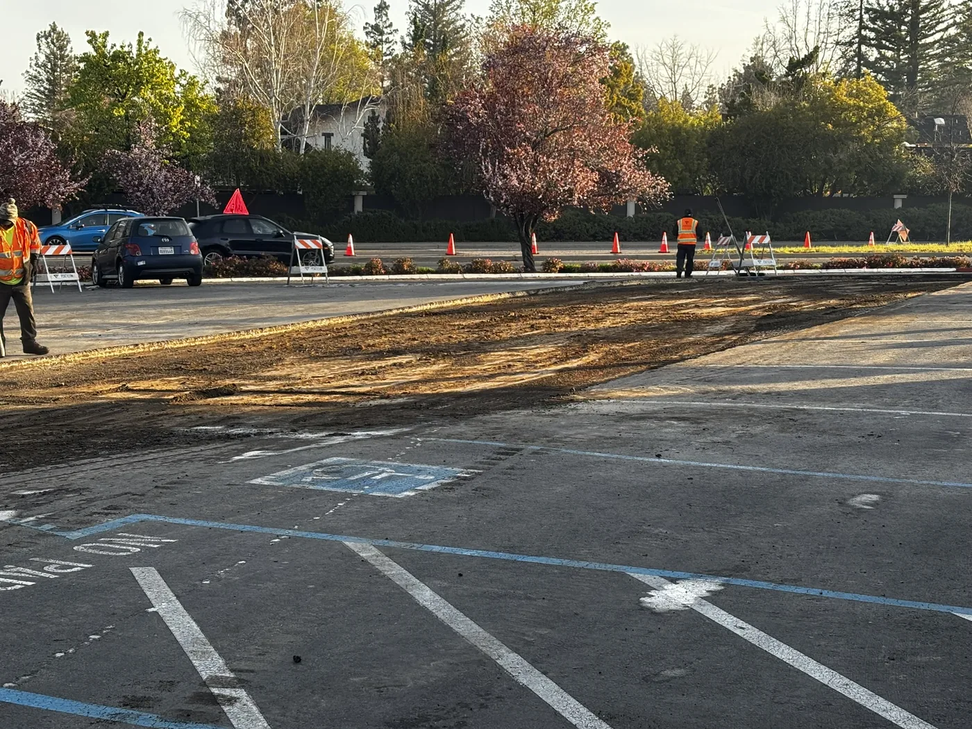 Accessible parking area and milled asphalt before paving and striping decisions