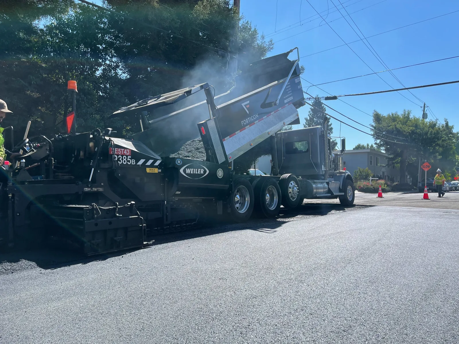 Forticon crew placing asphalt on a commercial paving project