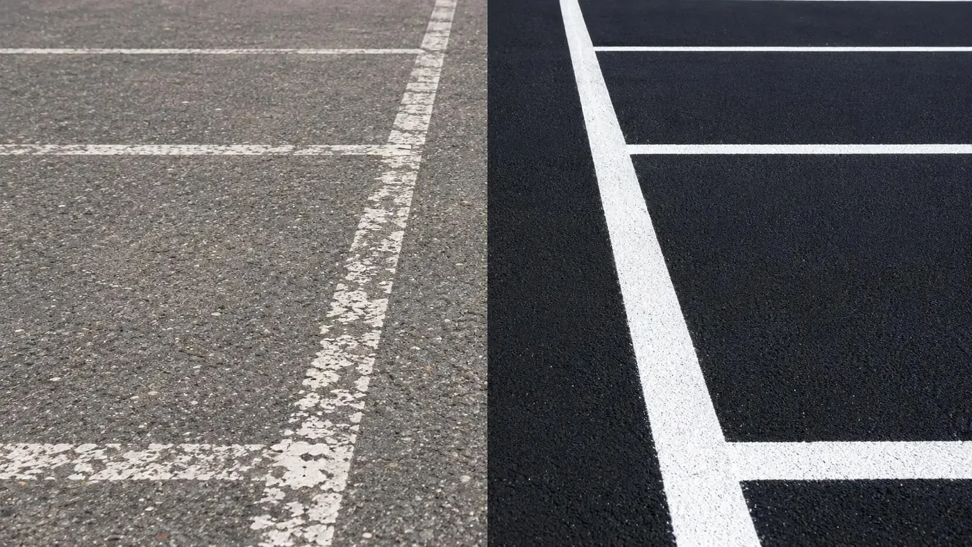 Before and after comparison of faded parking lot striping and fresh white pavement markings